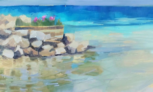 beach scene of water with rocks along the shore
